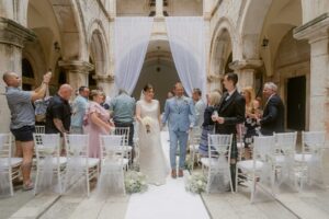 Dubrovnik destination wedding planner, Sponza Palace grand expit of bride and groom with confetti